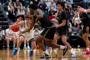 Lincoln Southwest guard Uzziah Sanders (2) reaches for the ball against a fury of Lincoln Southeast defenders during a high school basketball game, Thursday, Jan. 29, 2026, Lincoln, Nebraska. Photo by Braden Cochran.