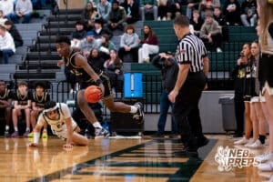 Lincoln Southeast Knight Prospedi Mukendi (33) moves past a fallen Lincoln Southwest Silverhawk Kobi Kerr (24) during a high school basketball game, Thursday, Jan. 29, 2026, Lincoln, Nebraska. Photo by Braden Cochran.