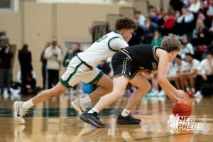 Lincoln Southwest guard Makkiah Sanders (10) dives for the ball with Lincoln Southeast point guard Carter Chatelain (2) during a high school basketball game, Thursday, Jan. 29, 2026, Lincoln, Nebraska. Photo by Braden Cochran.
