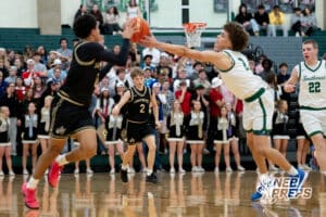 Lincoln Southeast guard Carter Chatelain (2) sends a pass down the court to teammate Rowan Lambert (0), defended by Lincoln Southwest guard Uzziah Sanders (2), during a high school basketball game, Thursday, Jan. 29, 2026, Lincoln, Nebraska. Photo by Braden Cochran.
