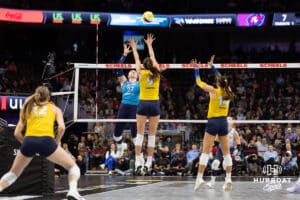 Omaha Supernovas Emily Londot (27) spikes the ball against San Diego Mojo Grace Loberg (9) and McKenna Vicini (14) in the first set during a professional volleyball match Friday, Jan. 30, 2026, in Omaha, Nebraska. Photo by John S. Peterson.