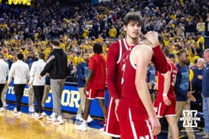 Nebraska Cornhusker forward Berke Büyüktuncel (9) gives forward Pryce Sandfort (21) a hug after the loss to the Michigan Wolverines during a college men’s basketball game Tuesday, Jan. 27, 2026, in Ann Arbor, Michigan. Photo by John S. Peterson.