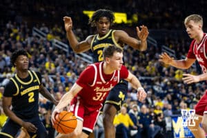 Nebraska Cornhusker guard Cale Jacobsen (31) drives the baseline to make a pass against the Michigan Wolverines in the second half during a college men’s basketball game Tuesday, Jan. 27, 2026, in Ann Arbor, Michigan. Photo by John S. Peterson.