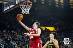 Nebraska Cornhusker forward Pryce Sandfort (21) makes a lay up against Michigan Wolverine center Aday Mara (15) in the second half during a college men’s basketball game Tuesday, Jan. 27, 2026, in Ann Arbor, Michigan. Photo by John S. Peterson.