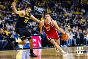 Nebraska Cornhusker forward Pryce Sandfort (21) drives the lane against Michigan Wolverine center Aday Mara (15) in the second half during a college men’s basketball game Tuesday, Jan. 27, 2026, in Ann Arbor, Michigan. Photo by John S. Peterson.
