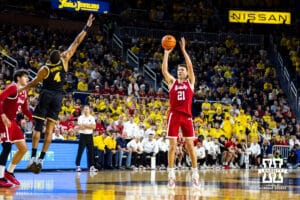 Nebraska Cornhusker forward Pryce Sandfort (21) makes a three point basket against Michigan Wolverine guard Nimari Burnett (4) in the first half during a college men’s basketball game Tuesday, Jan. 27, 2026, in Ann Arbor, Michigan. Photo by John S. Peterson.