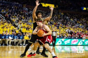 Nebraska Cornhusker guard Sam Hoiberg (1) drives into Michigan Wolverine guard Elliot Cadeau (3) for a basket in the first half during a college men’s basketball game Tuesday, Jan. 27, 2026, in Ann Arbor, Michigan. Photo by John S. Peterson.