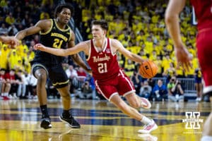 Nebraska Cornhusker forward Pryce Sandfort (21) drives the lane against Michigan Wolverine forward Morez Johnson Jr. (21) in the first half in the first half during a college men’s basketball game Tuesday, Jan. 27, 2026, in Ann Arbor, Michigan. Photo by John S. Peterson.