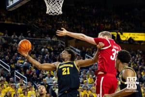 Michigan Wolverine forward Morez Johnson Jr. (21) pushes Nebraska Cornhusker forward Leo Curtis (33) rebounding the ball in the first half against during a college men’s basketball game Tuesday, Jan. 27, 2026, in Ann Arbor, Michigan. Photo by John S. Peterson.