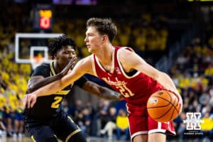 Nebraska Cornhusker forward Pryce Sandfort (21) drives the baseline against Michigan Wolverine guard L.j.c.ason (2) in the first half during a college men’s basketball game Tuesday, Jan. 27, 2026, in Ann Arbor, Michigan. Photo by John S. Peterson.