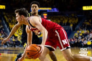 ebraska Cornhusker forward Pryce Sandfort (21) drives the baseline against Michigan Wolverine forward Yaxel Lendeborg (23) in the first half during a college men’s basketball game Tuesday, Jan. 27, 2026, in Ann Arbor, Michigan. Photo by John S. Peterson.