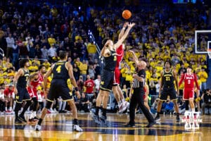 Nebraska Cornhusker guard Cale Jacobsen (31) wins the tip-off against Michigan Wolverine center Aday Mara (15) during a college men’s basketball game Tuesday, Jan. 27, 2026, in Ann Arbor, Michigan. Photo by John S. Peterson.