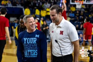 Nebraska Cornhusker head coach Fred Hoiberg meets with the Michigan Wolverine head coach Dusty May before a college men’s basketball game Tuesday, Jan. 27, 2026, in Ann Arbor, Michigan. Photo by John S. Peterson.