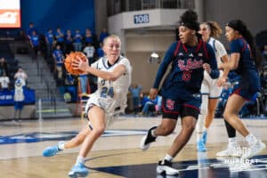 Creighton Bluejay Ava Zediker (24) drvies past Jailah Donald (5) during a college basketball game against St. John’s on Jan 28, 2026, in Omaha, Nebraska. Photo by Brandon Tiedemann