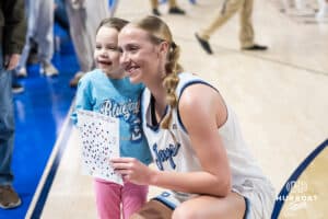 Creighton Bluejay Neleigh Gessert (23) meets a young fan after a college basketball game against St. John’s on Jan 28, 2026, in Omaha, Nebraska. Photo by Brandon Tiedemann