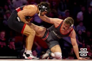 At 184, Nebraska Cornhusker Silas Allred tries to pull Ohio State Buckeye back onto the mat during a college wrestling dual Sunday, Jan. 25, 2026, Lincoln, Nebraska. Photo by Braden Cochran.