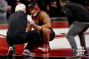 At 174, Nebraska wrestler Christopher Minto talks with head coach Mark Manning during a timeout during a college wrestling dual Sunday, Jan. 25, 2026, Lincoln, Nebraska. Photo by Braden Cochran.