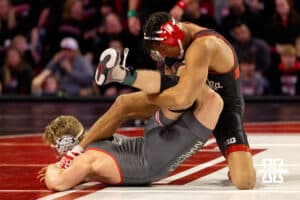 At 174, Nebraska Husker Christopher Minto bends Ohio State Buckeye Carson Kharcla feet over back during a college wrestling dual Sunday, Jan. 25, 2026, Lincoln, Nebraska. Photo by Braden Cochran.
