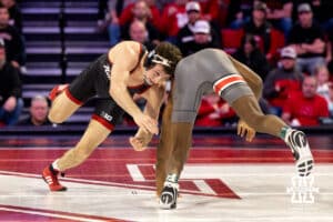 At 165, Nebraska wrestler LJ Arujo reaches for the leg of Ohio State wrestler e'Than Birden during a college wrestling dual Sunday, Jan. 25, 2026, Lincoln, Nebraska. Photo by Braden Cochran.
