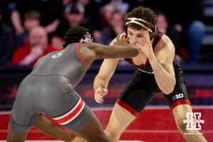 At 165, Nebraska Cornhusker LJ Arujo reachesto catch the hand of Ohio State Buckeye e'Than Birden during a college wrestling dual Sunday, Jan. 25, 2026, Lincoln, Nebraska. Photo by Braden Cochran.