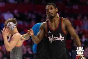 At 157, Nebraska Cornhusker Antrell Taylor walks back to the bench after having his hand raised in victory during a college wrestling dual Sunday, Jan. 25, 2026, Lincoln, Nebraska. Photo by Braden Cochran.