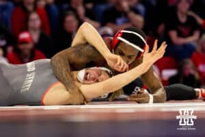At 157, Nebraska Cornhusker Antrell Taylor rolls over Ohio State Buckeye Maddox Shaw onto his back during a college wrestling dual Sunday, Jan. 25, 2026, Lincoln, Nebraska. Photo by Braden Cochran.