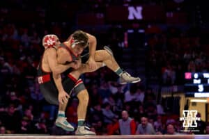 At 141, Nebraska wrestler Brock Hardy drags Ohio State Buckeye Jesse Mendez to the ground during a college wrestling dual Sunday, Jan. 25, 2026, Lincoln, Nebraska. Photo by Braden Cochran.