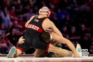 At 141, Nebraska Cornhusker Brock Hardy wraps his arm around Ohio State Buckeye Jesse Mendez during a college wrestling dual Sunday, Jan. 25, 2026, Lincoln, Nebraska. Photo by Braden Cochran.