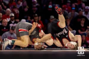 At 125, Nebraska wrestler Kael Laridsen is rolled onto his back by Ohio State wrestler Nic Bouzakis during a college wrestling dual Sunday, Jan. 25, 2026, Lincoln, Nebraska. Photo by Braden Cochran.