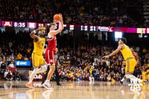Nebraska Cornhusker forward Pryce Sandfort (21) makes a three point shot against the Minnesota Golden Gophers in the second half during a college men’s basketball game on Saturday, Jan. 24, 2026, in Minneapolis, Minnesota. Photo by John S. Peterson.