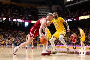 Nebraska Cornhusker forward Rienk Mast (51) drive to the basket against Minnesota Golden Gopher forward Jaylen Crocker-Johnson (5) in the second half during a college men’s basketball game on Saturday, Jan. 24, 2026, in Minneapolis, Minnesota. Photo by John S. Peterson.