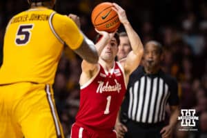 Nebraska Cornhusker guard Sam Hoiberg (1) makes a three point shot against Minnesota Golden Gopher forward Jaylen Crocker-Johnson (5) in the second half during a college men’s basketball game on Saturday, Jan. 24, 2026, in Minneapolis, Minnesota. Photo by John S. Peterson.