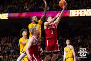 Nebraska Cornhusker guard Sam Hoiberg (1) drives to the basket against Minnesota Golden Gopher forward Jaylen Crocker-Johnson (5) in the second half during a college men’s basketball game on Saturday, Jan. 24, 2026, in Minneapolis, Minnesota. Photo by John S. Peterson.