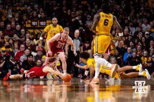 Nebraska Cornhusker guard Sam Hoiberg (1) dives for a loose ball against the Minnesota Golden Gophers in the second half during a college men’s basketball game on Saturday, Jan. 24, 2026, in Minneapolis, Minnesota. Photo by John S. Peterson.