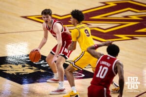 Nebraska Cornhusker forward Pryce Sandfort (21) dribbles the ball against Minnesota Golden Gopher guard Kai Shinholster (9) in the first half during a college men’s basketball game Saturday, Jan. 24, 2026, in Minneapolis, Minnesota. Photo by John S. Peterson.
