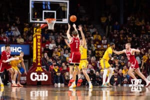 Nebraska Cornhusker guard Sam Hoiberg (1) makes a three point shot against Minnesota Golden Gopher forward Bobby Durkin (3) in the first half during a college men’s basketball game on Saturday, Jan. 24, 2026, in Minneapolis, Minnesota. Photo by John S. Peterson.