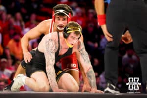 At 285, Nebraska Cornhusker AJ Ferrari waits for the referee to signal when to start against Iowa Hawkeye Ben Kueter during a college wrestling dual Friday, Jan. 23, 2026, Lincoln, Nebraska. Photo by Braden Cochran.