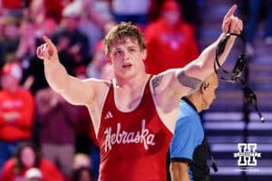 At 197, Nebraska Cornhusker Camden McDanel points to the crowd after the win over the Iowa Hawkeye Brody Sampson during a college wrestling dual on Friday, Jan. 23, 2026, Lincoln, Nebraska. Photo by Braden Cochran.