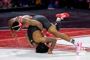 At 157, Nebraska Cornhusker Antrell Taylor explodes off the mat to flip over Iowa Hawkeye Jordan Williams during a college wrestling dual Friday, Jan. 23, 2026, Lincoln, Nebraska. Photo by Braden Cochran.