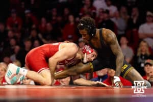 At 141, Nebraska Cornhusker Brock Hardy fights for leverage against Iowa Hawkeye Nasir Bailey during a college wrestling dual Friday, Jan. 23, 2026, Lincoln, Nebraska. Photo by Braden Cochran.