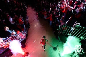A Nebraska wrestler leads the Huskers out to the mat for to take on the Iowa Hawkeyes during a college wrestling dual on Friday, Jan. 23, 2026, Lincoln, Nebraska. Photo by Braden Cochran.