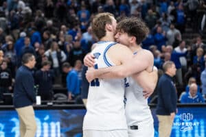 Creighton Bluejays Isaac Traudt (41) and Hudson Greer (10) hug after a college basketball game against Xavier on Jan 21, 2026, in Omaha, Nebraska. Photo by Brandon Tiedemann