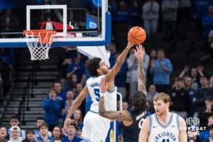 Creighton Bluejay Nik Graves (5) blocks a shot during a college basketball game against Xavier on Jan 21, 2026, in Omaha, Nebraska. Photo by Brandon Tiedemann