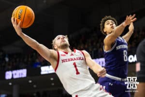 Nebraska Cornhuskers guard Sam Hoiberg (1) scores against Northwestern Wildcats forward Tre Singleton (8) during the second half of a college basketball game on Saturday, Jan. 17, 2026, in Evanston, Illinois. Photo by Kayla Wolf.