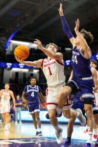 Nebraska Cornhuskers guard Sam Hoiberg (1) scores against Northwestern Wildcats guard Angelo Ciaravino (44) during the second half of a college basketball game on Saturday, Jan. 17, 2026, in Evanston, Illinois. Photo by Kayla Wolf.