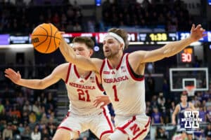 Nebraska Cornhuskers guard Sam Hoiberg (1) and forward Pryce Sandfort (21) go after a loose ball during the first half of a college basketball game against the Northwestern Wildcats on Saturday, Jan. 17, 2026, in Evanston, Illinois. Photo by Kayla Wolf.