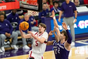 Nebraska Cornhuskers forward Braden Frager (5) scores against Northwestern Wildcats forward Nick Martinelli (2) and guard Jordan Clayton (11) during the first half of a college basketball game on Saturday, Jan. 17, 2026, in Evanston, Illinois. Photo by Kayla Wolf.