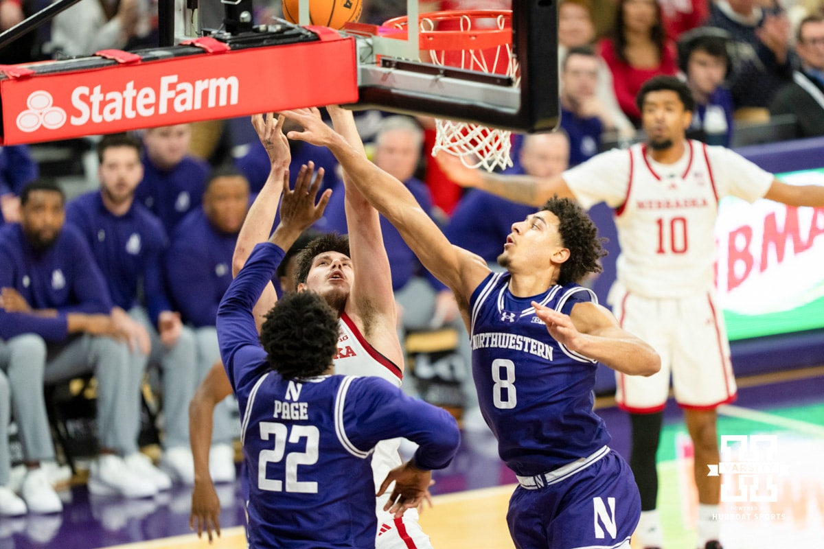 Nebraska Cornhuskers forward Berke Büyüktuncel (9) scores against Northwestern Wildcats forward Arrinten Page (22) and Northwestern Wildcats forward Tre Singleton (8) during the first half of a college basketball game on Saturday, Jan. 17, 2026, in Evanston, Illinois. Photo by Kayla Wolf.