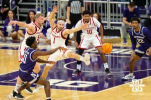 Nebraska Cornhuskers forward Rienk Mast (51) and guard Sam Hoiberg (1) play defense against Northwestern Wildcats guard Jordan Clayton (11) during the first half of a college basketball game on Saturday, Jan. 17, 2026, in Evanston, Illinois. Photo by Kayla Wolf.