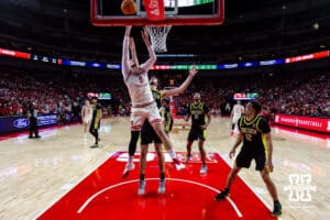 Nebraska Cornhusker forward Berke Büyüktuncel (9) makes a lay up against Oregon Duck center Nate Bittle (32) in the second half during a college men’s basketball game on Tuesday, Jan. 13, 2026, in Lincoln, Nebraska. Photo by John S. Peterson.